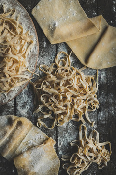  Italian traditional tagliatelle on the wooden table,high angle