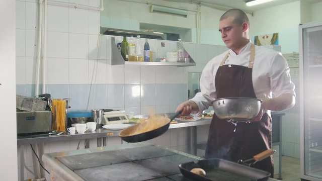 Process of cooking spaghetti - cheif in restaurant