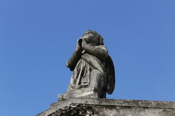 Stone statue in a lonely cemetery