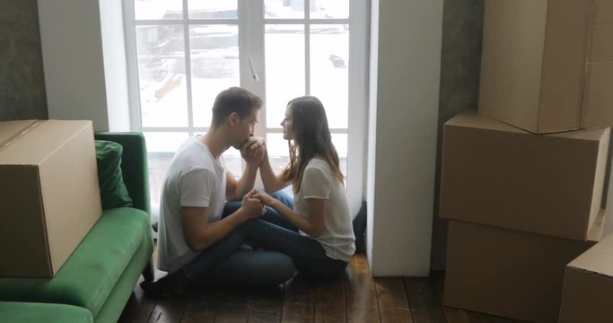 Young couple very happy and excited about moving into new apartment