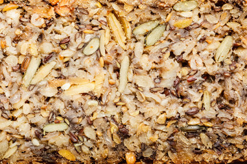 Detailed closeup whole grain bread with many grains