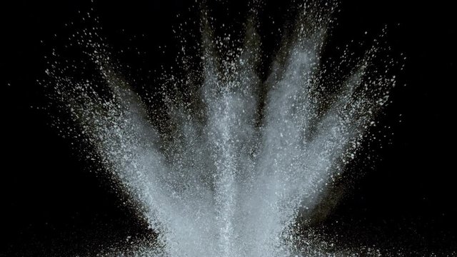 White powder exploding on black background in super slow motion, shot with Phantom Flex 4K