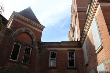 Fototapeta na wymiar Abandoned Brick Asylum Building