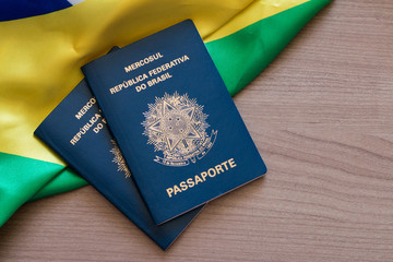 Brazilian passport on Brazilian flag