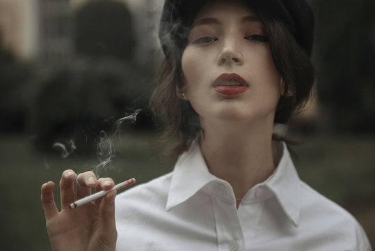Caucasian woman smoking cigarette