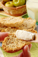 Cream cheese  smeared on wheat cracker