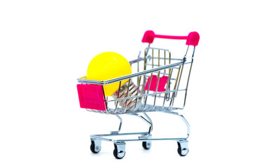 Mini shopping cart or supermarket trolley with yellow tungsten light bulb, isolated on white...