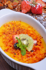 Delicious french dessert creme brulee  on the table