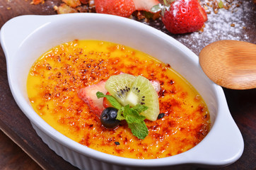 Delicious french dessert creme brulee  on the table