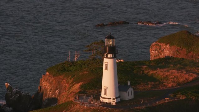 Aerial shot of Yaquina Head Lighthouse at sunset