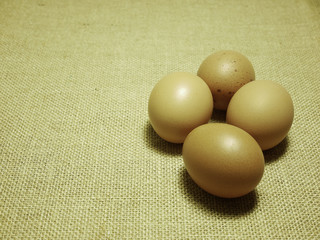 eggs on Hessian sackcloth woven texture background