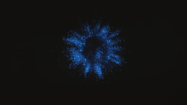 Blue powder exploding on black background in super slow motion, shot with Phantom Flex 4K