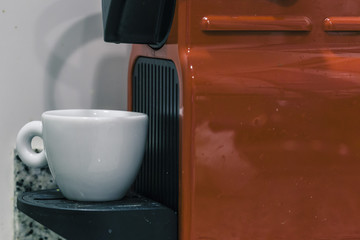 Espresso coffee machine with a white espresso cup