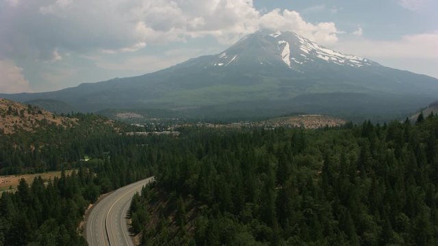 California circa-2017, Aerial shot of Mt. Shasta and I-5 freeway.  Shot with Cineflex and RED Epic-W Helium. 