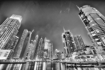 DUBAI, UAE - DECEMBER 5, 2016: Dubai Marina skyline at night. The city attracts 30 million tourists annually