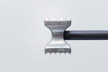 steel meat hammer close up image on white background studio light.
