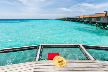 Fototapeta premium Hat and pillow at net over sea.