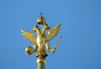Fototapeta na wymiar Russian two-headed eagle on top of a tower at the Red square in Moscow. Coat of arms of Russia on the background of clear sky