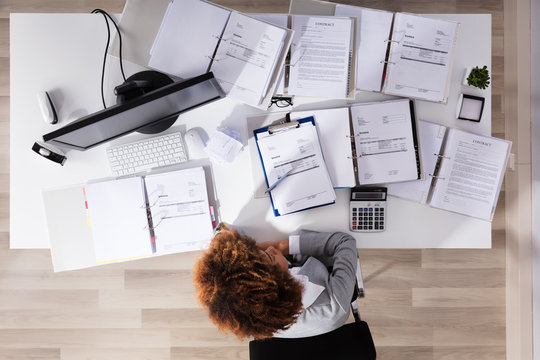 Unhappy Afro American Businesswoman Sitting In Office