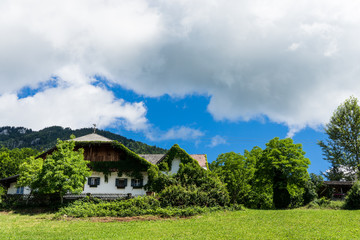 Fototapeta na wymiar View on austrian alps and traditional buildings