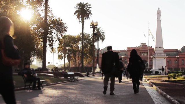 People Walking in Plaza de Mayo with Casa Rosada at Sunset, Buenos Aires, Argentina
