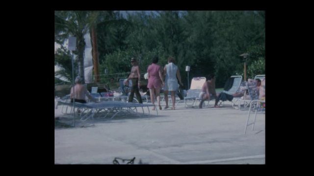 1970 2 women blow kisses, wave goodbye and walk away