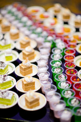 Glass shots  pastry. wedding catering food. mini canapes food.  tasty dessert. Beautiful decorate catering banquet table.  snacks and appetizers. wedding celebration