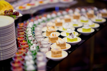 Glass shots  pastry. wedding catering food. mini canapes food.  tasty dessert. Beautiful decorate catering banquet table.  snacks and appetizers. wedding celebration