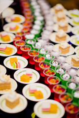 Glass shots  pastry. wedding catering food. mini canapes food.  tasty dessert. Beautiful decorate catering banquet table.  snacks and appetizers. wedding celebration