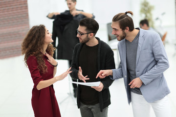 group of designers discussing the sketches.