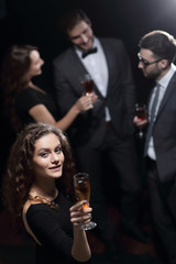 stylish young woman with glass of champagne