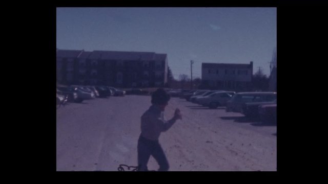 1970 12 year old Boy runs to fly kite