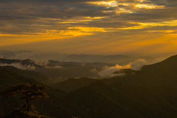 Photo landscape and sunset.The Sunset on the mountains. High  Mountain in chaingrai  province Thailand.