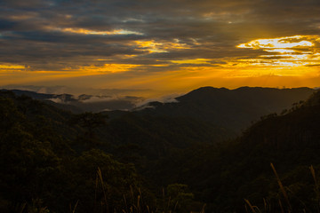 Naklejka premium Photo landscape and sunset.The Sunset on the mountains. High Mountain in chaingrai province Thailand.