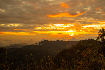 Photo landscape and sunset.The Sunset on the mountains. High  Mountain in chaingrai  province Thailand.
