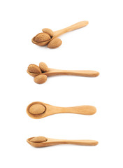 Almond nut in a wooden spoon isolated