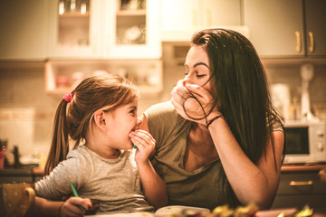 Mommy make me laughing. Little girl spending time with mother.