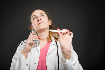 Female nutritionist cooling herself having fever