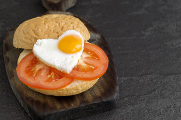 Breakfast on Valentine's day. sandwich with egg and avocado.