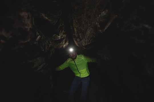 Hiker exploring cave