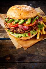 Avocado and guacamole burger with French fries