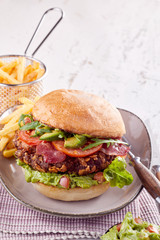 Pork belly burger with fresh avocado and bacon