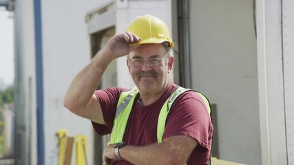 Portrait of truck driver at shipping facility