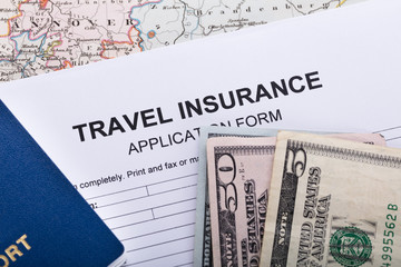 Currency Notes And Passport On Insurance Application Form