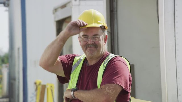 Portrait of truck driver at shipping facility
