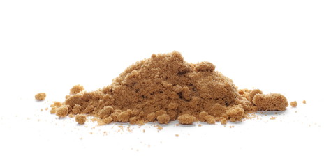 Unrefined brown cane sugar pile isolated on white background