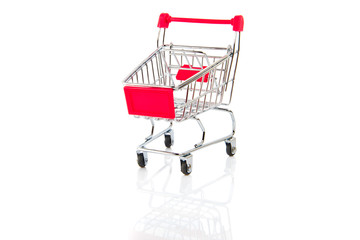 Empty red shopping cart isolated on white background.