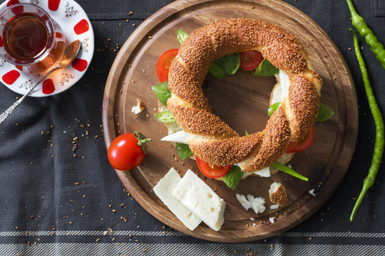 Turkish bagel with cheese, tomato, green pepper, basil, tea