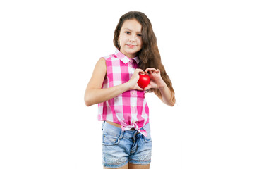 little girl in a plaid sleeveless shirt shows a heart
