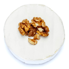 Round brie or camambert cheese on a white background